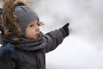 Little boy toddler pointing on something copy space background portrait picture