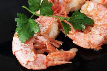 Shrimp Parsley Dish on black plate in cafe