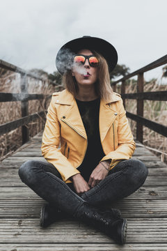 Girl with black hat and yellow jacket