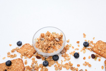 Fototapeta na wymiar Crunchy muesli cookies and blueberries, Breakfast cereals isolated on white background, selective focus, top view