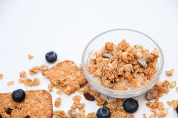 Crunchy muesli cookies and blueberries, Breakfast cereals isolated on white background, selective focus, top view