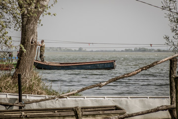 Fototapeta premium Man in a boat