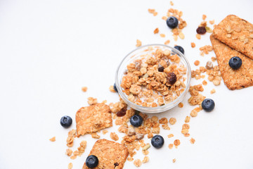 Crunchy muesli cookies and blueberries, Breakfast cereals isolated on white background, selective focus, top view