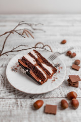  Delicious chocolate cake on plate on table on light wooden background 