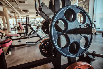 Fototapeta premium Closeup photo shoot of training apparatus in sunny gym.