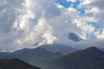 View of Caucasus mountains near Kazbek peak, Stepantminda, Georgia