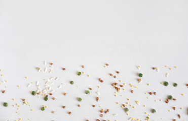 Pattern with buckwheat, wheat, peas and rice on a white background. Pattern with porridge for food
