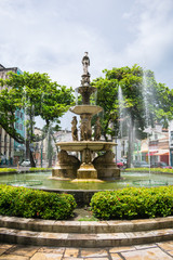 Fototapeta na wymiar Recife, Brazil - Circa April 2019: Water fountain at Maciel Pinheiro square in Boa Vista neighborhood