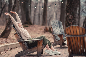 Woman relaxing in the forest on weekeend