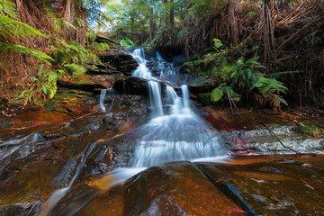 Small waterfall in the mountains after a heavy rain.