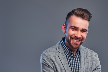 Obraz premium Portrait of happy smiling man in checkered shirt and gray blaser.