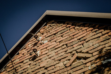 Old ceramic powerline insulators on a wall