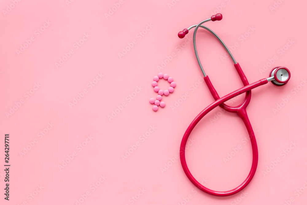 Wall mural diagnostic and cure of gynaecological disease with stethoscope and female symbol on pink background 