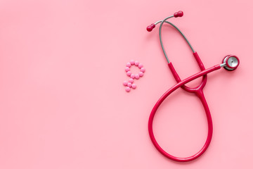 diagnostic and cure of gynaecological disease with stethoscope and female symbol on pink background top view mock-up - obrazy, fototapety, plakaty