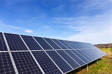 Solar Power Station on the early spring Meadow 