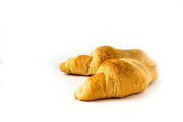 freshly baked croissant isolated on white background