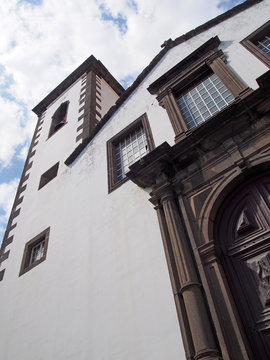 the tower and door of São Pedro church in funchal a historic 17th century building in madeira notable for the colored tiles on the spire