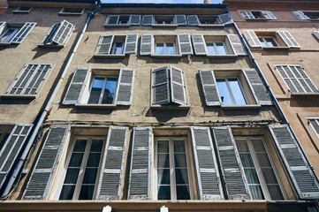 Shutters on the windows of townhouses in the city of Aix-en-Provence in France..