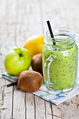 Green smoothie with kiwi, apple, lemon and chia seeds. Healthy fresh diet eating, superfood.