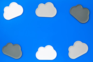 cloud service concept with clouds on blue background top view mockup