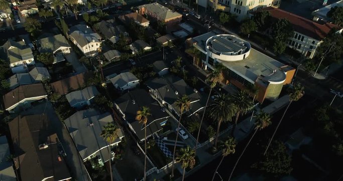 Aerial view of the Los Angeles Downtown area. Drone view of DTLA in SLOW MOTION. Natural light at sunset hour. Palm trees and buildings make a great clip for long scenes by Airflow Creations.