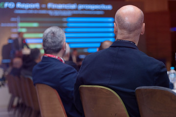 Businessman at business conference room with public giving presentations. Audience at the conference hall. Entrepreneurship club.