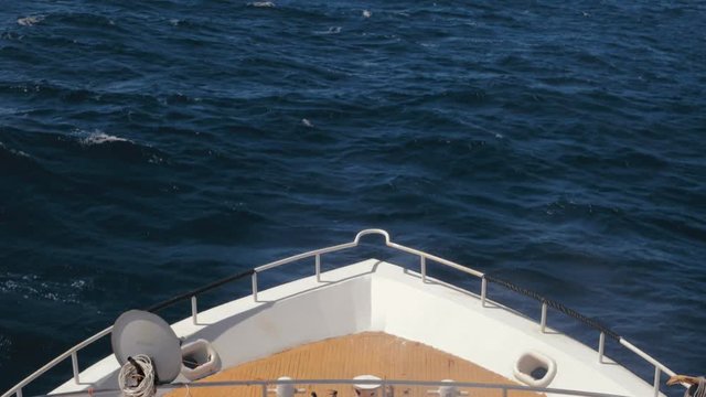 Yacht heading toward the horizon on the sea