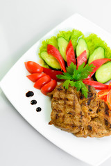 steak meat prepared with fresh vegetables 