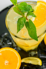 orange juice with ice and mint isolated on white