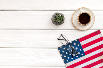 Obraz premium Memoral day of United States of America with flag, glasses and coffee on white background top view mockup