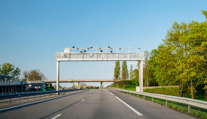 French autoroute highway security surveillance cameras and radars on poles on the empty highway   