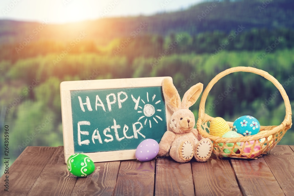 Canvas Prints Painted Easter eggs in a basket and rabbit