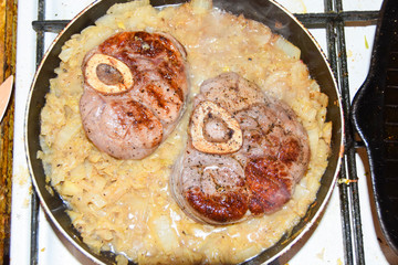 Ossobuko grilled beef with cabbage in a pan cooking dish