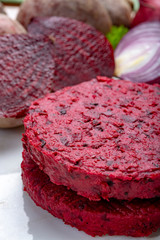 Healthy vegetarian food, raw round burgers made from red beetroot