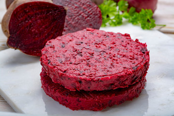 Healthy vegetarian food, raw round burgers made from red beetroot