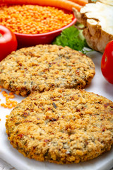 Tasty vegetarian food, raw burgers made from lentils legumes with vegetables ready for cooking
