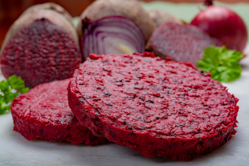 Healthy vegetarian food, raw round burgers made from red beetroot