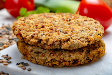 Tasty vegetarian food, raw burgers made from lentils legumes with vegetables ready for cooking