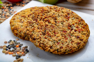 Tasty vegetarian food, raw burgers made from lentils legumes with vegetables ready for cooking
