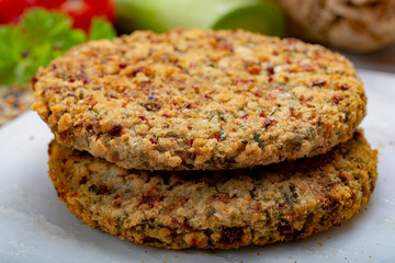 Tasty vegetarian food, raw burgers made from lentils legumes with vegetables ready for cooking