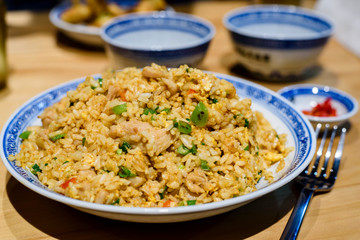Chinese fried rice with chicken and vegetable in a plate.