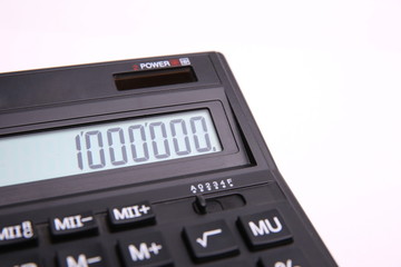 Number 1000000 on the calculator screen on a white background on the side. One million. Mega on calculator screen.