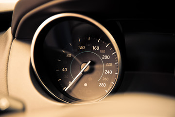 analog car speedometer close-up. speedometer of car dashboard toned photo.