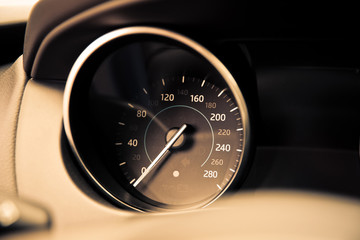 Naklejka premium analog car speedometer close-up. speedometer of car dashboard toned photo.