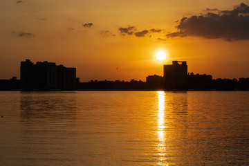 Fototapeta na wymiar sunset over Whittier Center, Detroit River