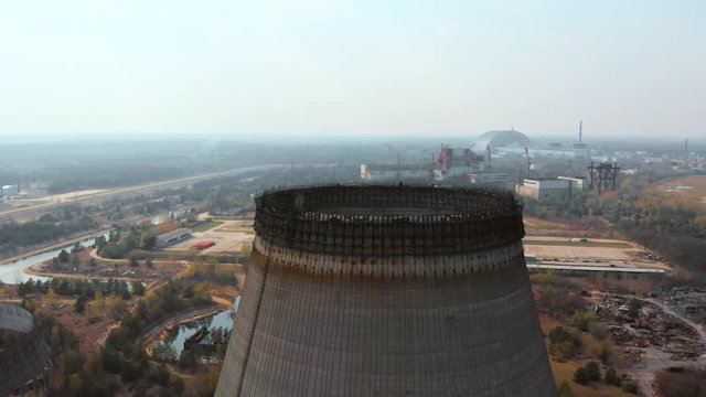 Chernobyl nuclear power plant. Cooling tower overlooking the nuclear power plant in Chernobyl. Sarcophagus over a nuclear power plant in Chernobyl, Ukraine. View of the destroyed nuclear power plant.
