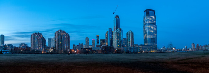 Fototapeta premium View of New Jersey Skyscrappers from Liberty Park at Night