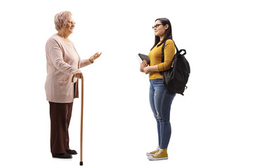 Senior woman and a female student standing and talking