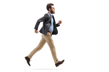 Bearded man in formal clothes running