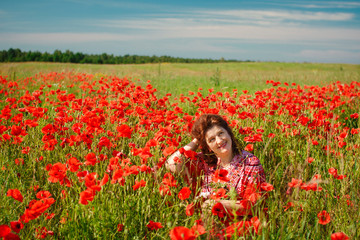 Portrait smiling happy old Elderly woman having fun, walking in a field with poppy flowers. Healthcare lifestyle senior lady relax in spring. Female in summer time.